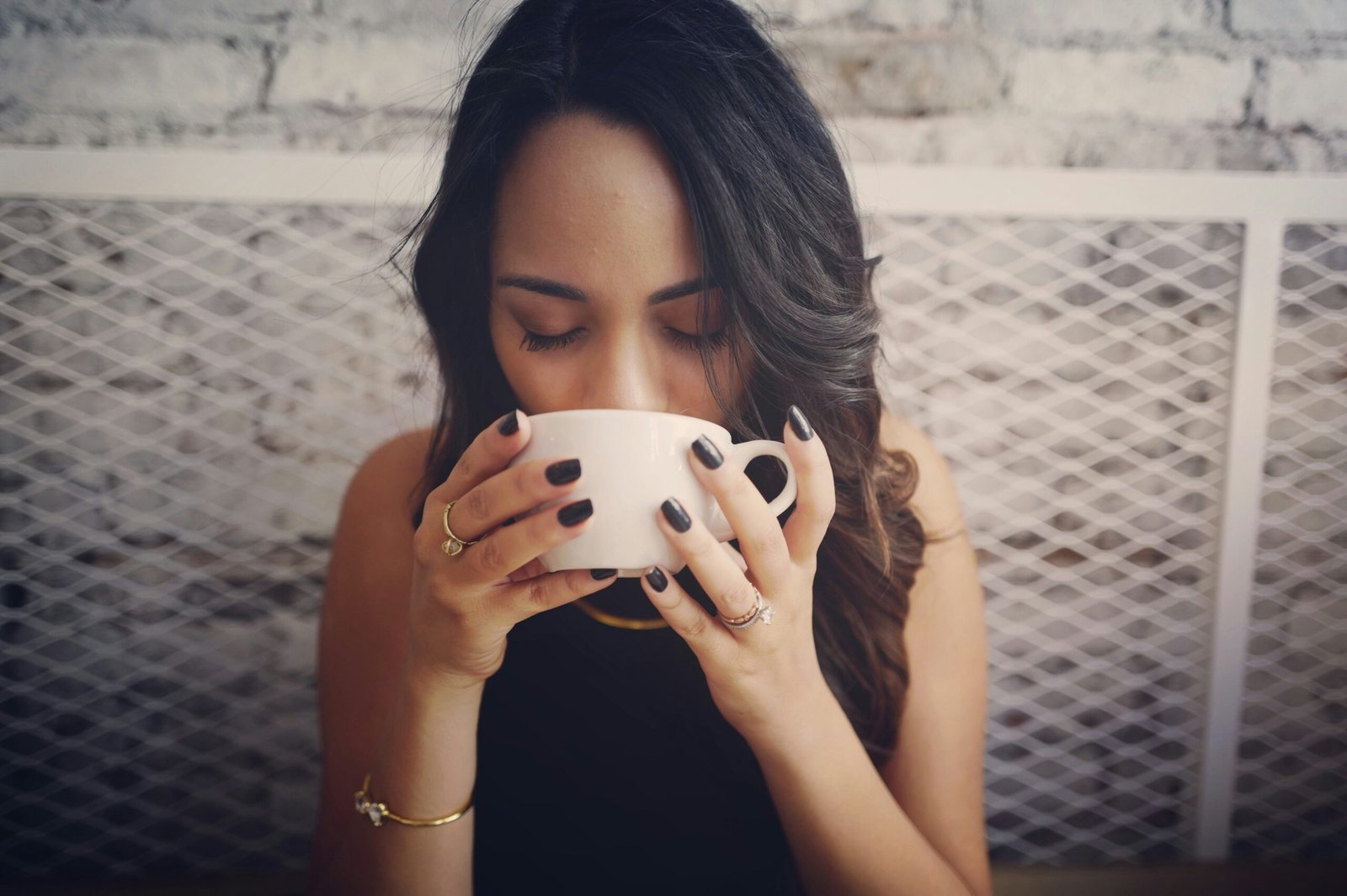 Woman drinking AASANA Relax Herbal Tea